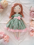 Handmade rag doll wearing a sage green floral dress by Sweet Dream Rose