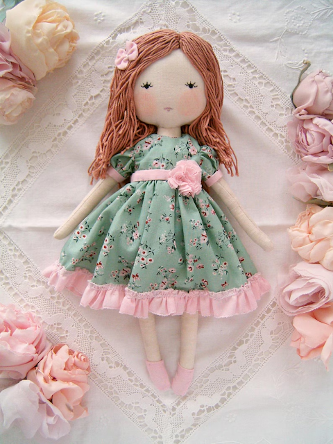 Handmade rag doll wearing a sage green floral dress by Sweet Dream Rose